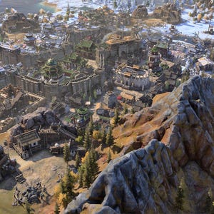 May include: An aerial view of a detailed, medieval-style city nestled between mountains and a snowy landscape. The city features stone walls, buildings with green roofs, and a central structure with a distinctive dome. The scene is bathed in sunlight.
