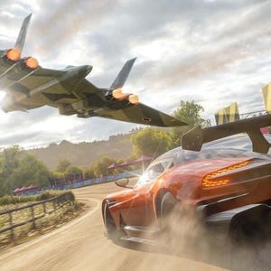 May include: An orange sports car speeds down a dirt road, with a camouflage jet plane flying overhead. The car has a large spoiler and the word "HORIZON" on the license plate. A green sign reads "CHECKPOINT".