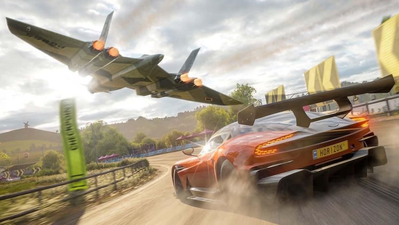 May include: An orange sports car speeds down a dirt road, with a camouflage jet plane flying overhead. The car has a large spoiler and the word "HORIZON" on the license plate. A green sign reads "CHECKPOINT".