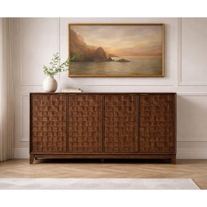 May include: A dark brown wooden cabinet with four doors and a textured, woven-like pattern. A painting of a seascape hangs above the cabinet. A white vase with greenery sits on top of the cabinet.