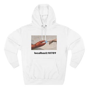 May include: White hoodie with a front graphic depicting a red lobster claw and a human finger with a blue light effect. The text "localhost:18789" is printed below the graphic. The hoodie has a drawstring hood and a front pocket.