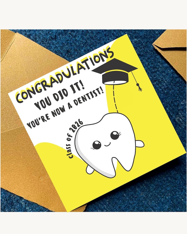 May include: A graduation card with the text "CONGRATULATIONS YOU DID IT! YOU'RE NOW A DENTIST!" features a cartoon tooth wearing a graduation cap. The card is yellow and white, with the words "class of 2026".