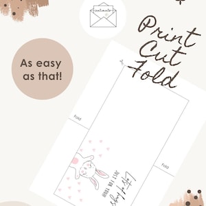 May include: A white card with a bunny illustration and the text "Lots of hugs, Just for you!". The card also has the text "Print, Cut, Fold" and "As easy as that!"
