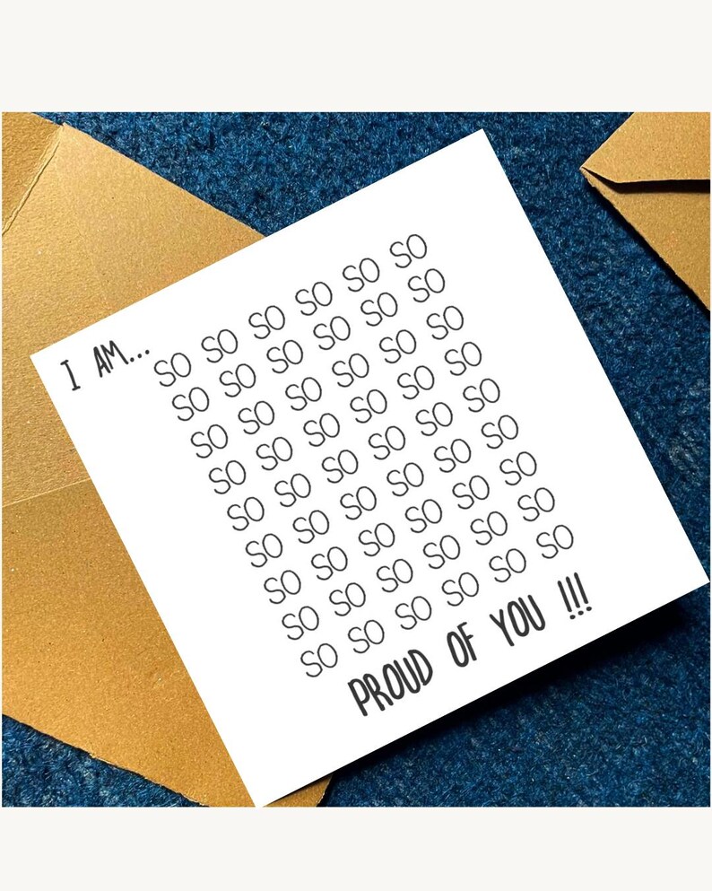 May include: A white card with the text "I AM... SO SO SO SO SO SO... PROUD OF YOU !!!" is placed inside a gold envelope, set against a dark blue textured background. The card's message is repeated multiple times.