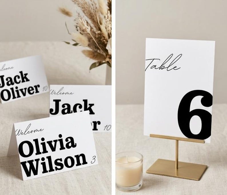 May include: White table cards with black text, including names and numbers. One card reads "Table 6" on a gold stand. Other cards display names like "Jack Oliver" and "Olivia Wilson". A lit candle sits nearby.