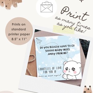 May include: A printable card with a polaroid frame design. The card features a blue sky background with a paper airplane and a cute bear illustration. Text includes "Do you really have to go sooooo many miles away from me?" and "Looootssss of love for you!!!" Prints on A4 paper (21 x 29.7 cm).