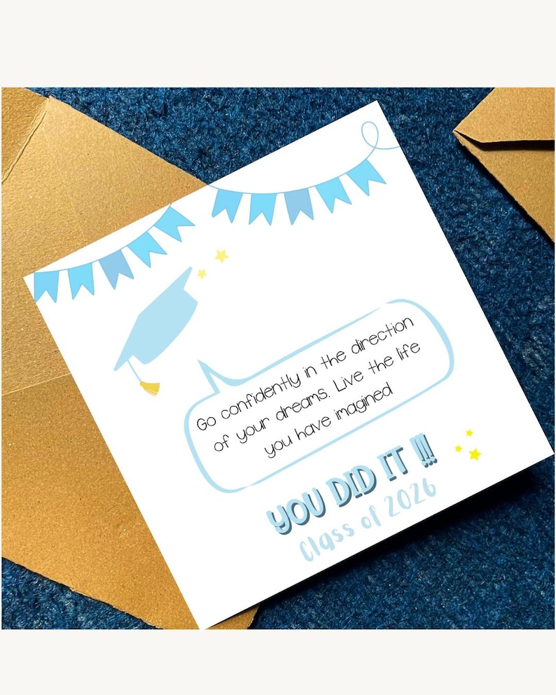 May include: A graduation card with a light blue mortarboard illustration and banner. The card reads "Go confidently in the direction of your dreams. Live the life you have imagined. YOU DID IT!! Class of 2026."