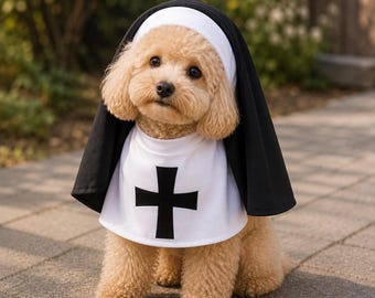 May include: A light brown curly-haired dog wearing a black and white nun costume. The outfit consists of a white bib-style collar featuring a prominent black cross on the front and a black headpiece with a white band framing the dog's face.