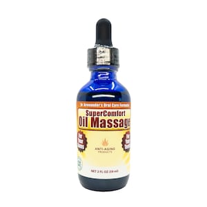 May include: A blue glass bottle of SuperComfort Oil Massage. The bottle has a black dropper and a silver cap. The label is orange and yellow with the text "SuperComfort Oil Massage" and "Anti-Aging Products". The bottle contains 59 ml.
