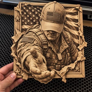 May include: A square wooden wall plaque featuring a laser-engraved relief of a soldier wearing a cap with an American flag patch. The soldier reaches forward with an open hand, set against a background of a waving American flag and stars.