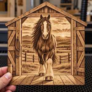 May include: A laser-engraved wooden plaque shaped like a barn entrance, featuring a detailed image of a horse with a white blaze and feathered hooves standing in a doorway, with a coiled rope and a barrel visible on the side frame.