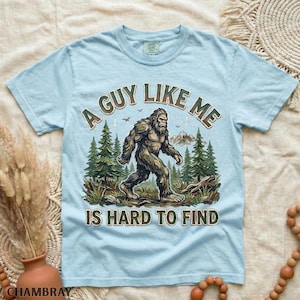 Funny Bigfoot Shirt, A Guy Like Me Is Hard to Find Tee, Sasquatch Graphic T-Shirt, Camping Humor Tee, Outdoors Lover Gift, Nature Lover Tee Chambray