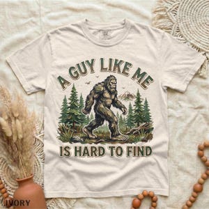 Funny Bigfoot Shirt, A Guy Like Me Is Hard to Find Tee, Sasquatch Graphic T-Shirt, Camping Humor Tee, Outdoors Lover Gift, Nature Lover Tee Ivory