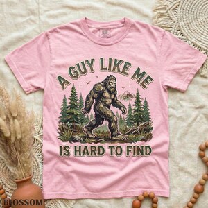 Funny Bigfoot Shirt, A Guy Like Me Is Hard to Find Tee, Sasquatch Graphic T-Shirt, Camping Humor Tee, Outdoors Lover Gift, Nature Lover Tee Blossom