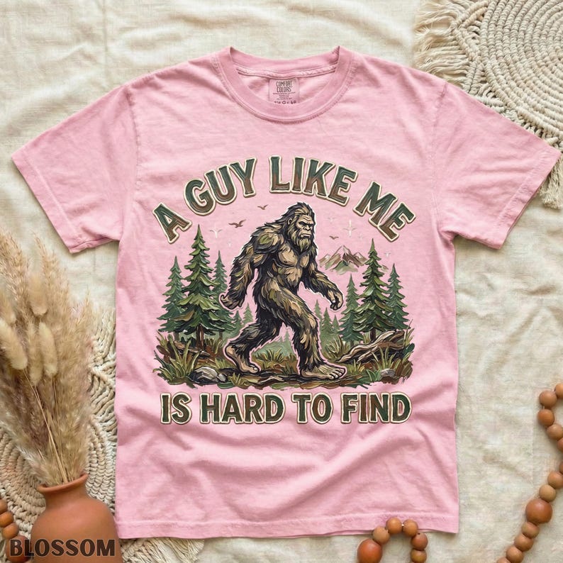 Funny Bigfoot Shirt, A Guy Like Me Is Hard to Find Tee, Sasquatch Graphic T-Shirt, Camping Humor Tee, Outdoors Lover Gift, Nature Lover Tee Blossom