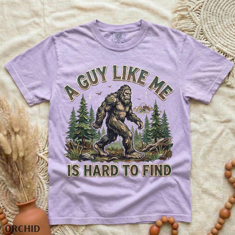 Funny Bigfoot Shirt, A Guy Like Me Is Hard to Find Tee, Sasquatch Graphic T-Shirt, Camping Humor Tee, Outdoors Lover Gift, Nature Lover Tee Orchid