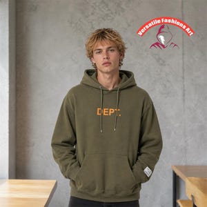 May include: An olive green hoodie with the word "DEPT." printed in orange across the chest. The hoodie has a drawstring hood and a front pocket. The image also includes the text "Versatile Fashions Art".