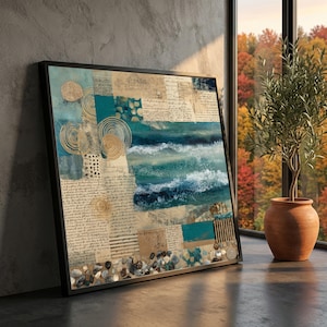 May include: Framed abstract art print with a collage of ocean waves, script, and textured elements in teal, beige, and gold. The artwork is displayed on a dark surface next to a potted olive tree, with a view of autumn foliage.