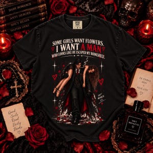 Black Comfort Colors 1717 dark romance reader shirt with distressed red and white gothic artwork featuring a dangerous fictional book boyfriend carrying a woman and the phrase “Some Girls Want Flowers, I Want a Man Who Looks Like He Escaped My Bookshelf.” Bookish graphic tee for spicy romance readers, fictional men fans, morally gray character lovers, BookTok readers, romance book lovers, and gothic reader style by Soft Menace Co.