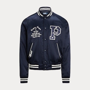 May include: A navy blue satin varsity jacket featuring white striped ribbed trim on the collar, cuffs, and hem. The front displays white embroidered text including Eastern League, 66-67, and a large letter P with Polo R.L. branding.