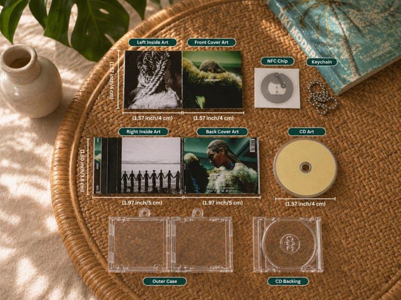 May include: A miniature CD set featuring a clear outer case, a yellow disc, and an NFC chip with a keychain. The set includes printed art panels showing a person and a group of people holding hands, with labels indicating dimensions of 1.57 to 1.97 inches.