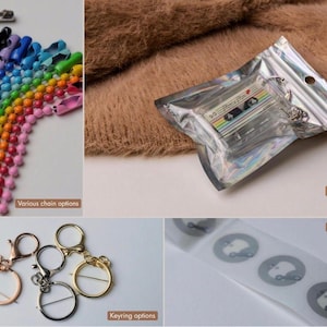 May include: A collection of colorful ball chains, a cassette tape keychain in a holographic pouch, various metal keyring attachments, and a strip of circular NFC chips. The cassette tape features a rainbow stripe design and the text Mixtape.