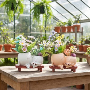 May include: A set of three ceramic mugs with a speckled, matte finish. The mugs are in shades of cream, light grey, and dark grey. Each mug has a simple, minimalist design, ideal for coffee or tea.