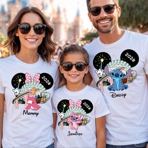 May include: White t-shirts with Disney-themed graphics. One shirt features Stitch, the other features Angel, and the third features Princess Aurora. Each shirt has a Mickey Mouse head design with the year 2026.