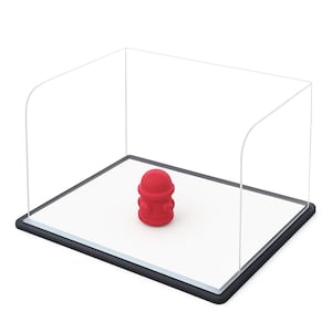 May include: A red fire hydrant model is displayed within a clear, rectangular case with a black border. The miniature hydrant sits on a white base, offering a clean, modern presentation.