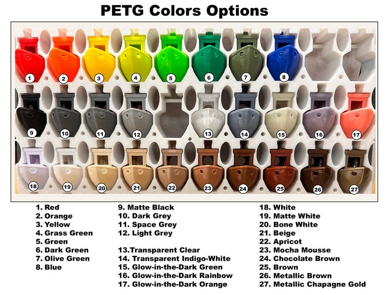 May include: A color chart displaying 27 PETG color options. The colors are arranged in rows and columns, with each color represented by a small, boat-shaped object. The colors include red, orange, yellow, green, blue, and various shades of gray, brown, and white. Text labels identify each color.