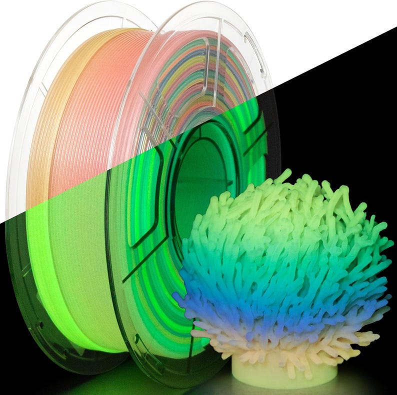May include: Two spools of 3D printer filament in a clear plastic casing, one with a gradient of colors and the other with a mix of colors. A 3D-printed coral reef model is also visible, with a gradient of colors from yellow to blue.