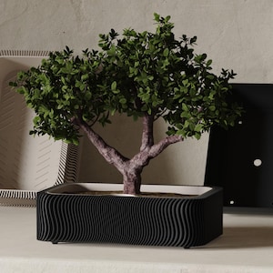 Può includere: Un set di tre tazze in ceramica con finitura opaca e macchiettata. Le tazze sono nei toni del crema, grigio chiaro e grigio scuro. Ogni tazza ha un design semplice e minimalista, perfetto per caffè o tè.