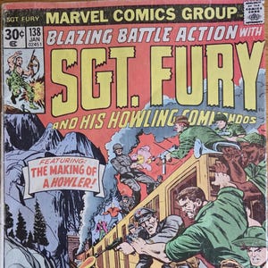 May include: A vintage Sgt. Fury comic book cover. The cover features a dynamic action scene with soldiers on a train, explosions, and the text "Blazing Battle Action." The comic is from Marvel Comics Group.