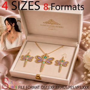 May include: A gold-toned jewelry set featuring a dragonfly pendant necklace and matching dragonfly earrings with purple and teal accents, presented in a cream-colored box labeled Luxe Embroidery Designs with 4 SIZES 8 Formats text.