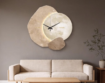 Reloj de pared inspirado en la piedra, luz ambiental LED, movimiento de cuarzo silencioso, decoración minimalista.