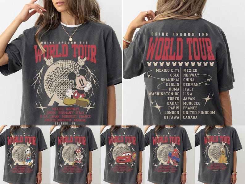 May include: Dark gray t-shirt with a graphic of Mickey Mouse in front of a geometric sphere, with the text "DRINK AROUND THE WORLD TOUR". The back of the shirt lists cities and countries. Additional shirts feature other Disney characters.