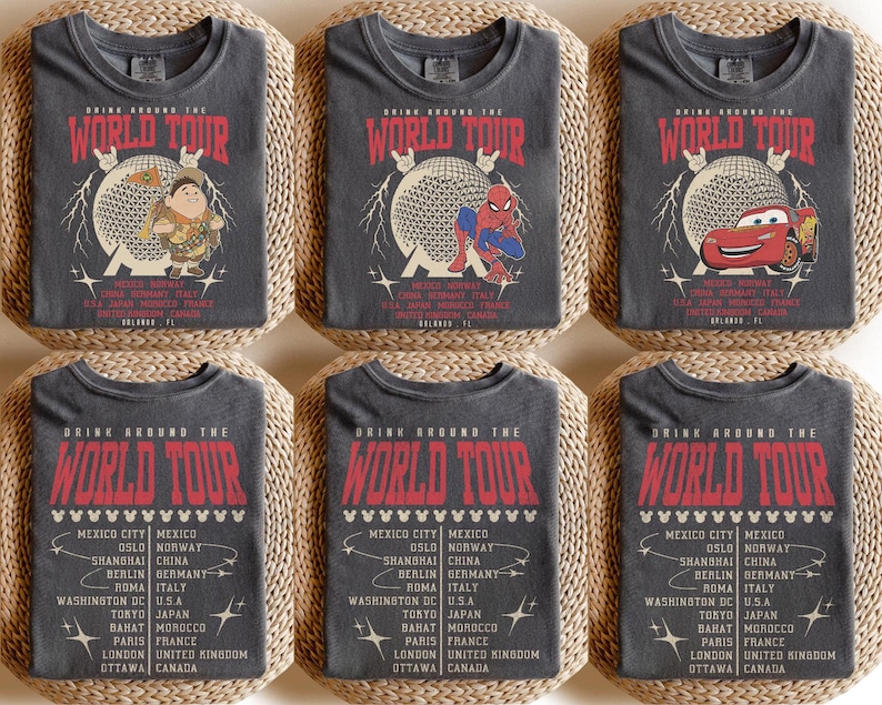 May include: Six gray t-shirts with the text "DRINK AROUND THE WORLD TOUR" in red. Each shirt features a different graphic: a cartoon character, Spider-Man, and a red race car. The shirts include a list of cities.