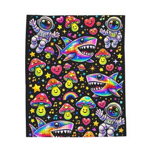 May include: A black blanket featuring a vibrant, cartoonish design. The pattern includes smiling mushrooms, rainbow sharks, astronauts, hearts, stars, musical notes, and a rainbow. The blanket is a colorful and whimsical accessory.