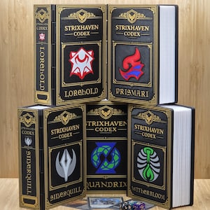 May include: Black and gold Strixhaven Codex boxes with different faction symbols and names: Lorehold, Prismari, Silverquill, Quandrix, and Witherbloom. The boxes are designed to look like books, with the text "Strixhaven Codex" on the front.