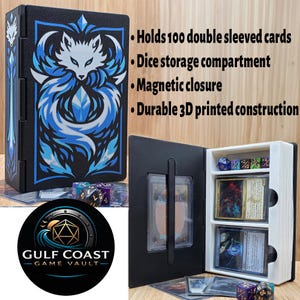 May include: Black card storage box with a blue and white wolf design. The box holds 100 double-sleeved cards, has a dice storage compartment, and a magnetic closure. The text on the box says "Holds 100 double sleeved cards, Dice storage compartment, Magnetic closure, Durable 3D printed construction."