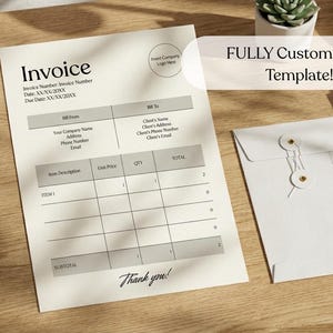 May include: A customizable invoice template on a wooden surface, with the text "Invoice" at the top. The template includes fields for item descriptions, prices, and totals. A white envelope and two books are also present.
