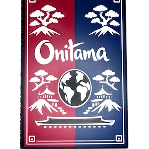May include: A rectangular board game box cover featuring a split red and blue background. The white text Onitama is centered. White graphics include four stylized trees, two mountain peaks, a central globe, and a building silhouette at the base.