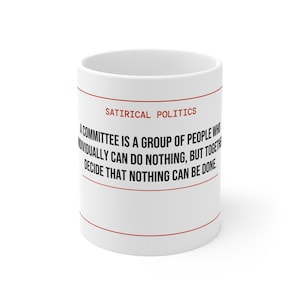 May include: White ceramic mug with the text "SATIRICAL POLITICS" and a humorous quote about committees in red. The mug has a red line at the top and bottom.