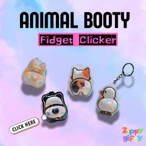 May include: Four animal-themed fidget clickers featuring a corgi, a calico cat, a panda, and a duck. Each piece displays a colourful, patterned backside. The text ANIMAL BOOTY and Fidget Clicker appear above the items, with a CLICK HERE button below.