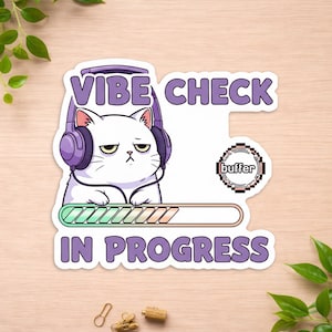 May include: A white cat wearing purple headphones, with the text "VIBE CHECK IN PROGRESS". The sticker also includes a loading bar and a "buffer" icon. The cat has a grumpy expression.