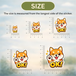 K&ouml;nnte beinhalten: Eine Auswahl an orangefarbenen und wei&szlig;en Shiba Inu-Aufklebern mit dem Text "OK!" und einer winkenden Pfote. Die Aufkleber werden in verschiedenen Gr&ouml;&szlig;en mit Messungen in Zentimetern gezeigt. Der Text "SIZE" und "Die Gr&ouml;&szlig;e wird von der l&auml;ngsten Seite des Aufklebers gemessen" ist enthalten.