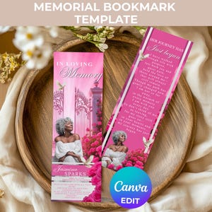 May include: Two pink memorial bookmarks with floral and architectural elements. One bookmark reads "In Loving Memory" and features a woman's image. The other bookmark has text that reads "Her Journey Has Just Begun".