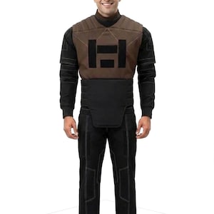 A premium galactic bounty hunter cosplay costume worn by a male model looking sideways, showcasing the screen-accurate ribbed double-sleeve detailing, dark brown flak vest, and black tailored undersuit over a solid white background.