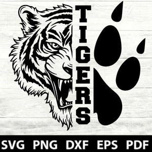 May include: A black and white graphic design showing a tiger's face and paw print. The word "TIGERS" is stacked vertically. The image is a digital file, with file type options: SVG, PNG, DXF, EPS, and PDF.