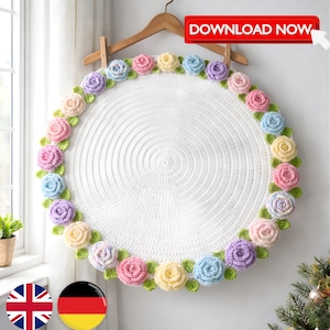 Könnte beinhalten: Ein weißes, kreisförmiges Häkelstück mit einem floralen Rand aus pastellfarbenen Rosen und grünen Blättern. Das Stück hängt an einem Holzbügel. Der Text "DOWNLOAD NOW" befindet sich in einem roten Rechteck oben rechts.